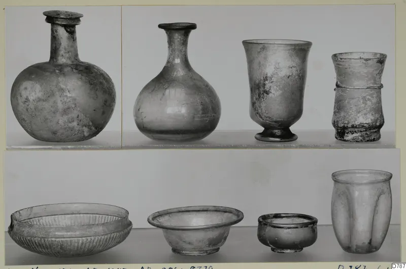 Eight glass vessels, bottles, beakers and bowls, shown in two rows against a pale background