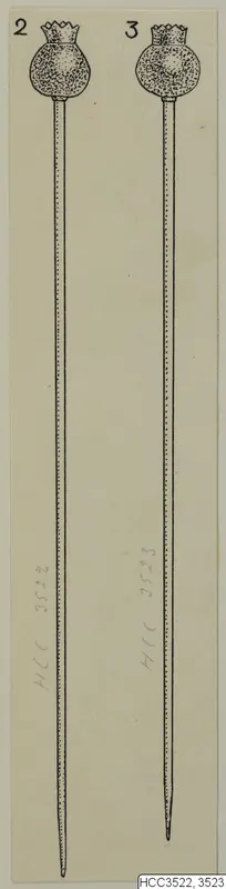 Line drawing of two long pins with round, notched heads