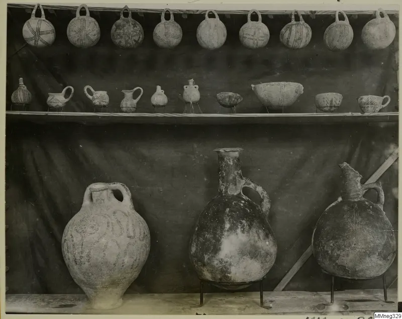 Pots with a pattern from Cyprus, arranged on wooden shelves in the Cyprus Museum