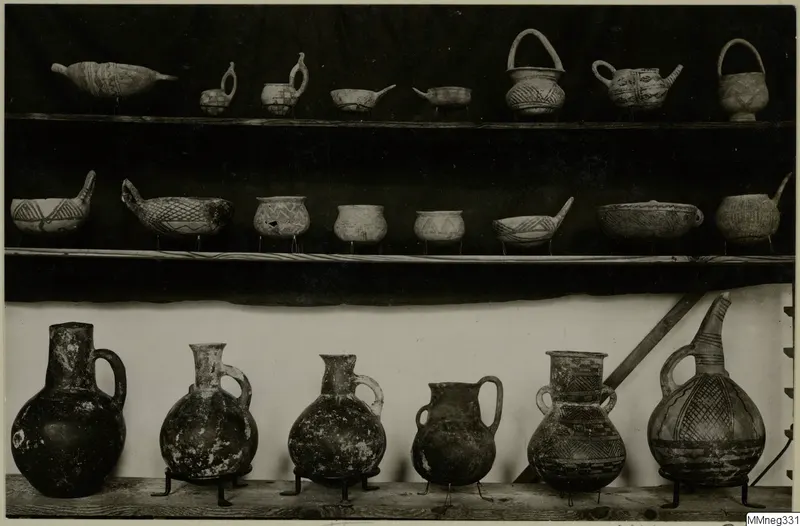 Three shelves of painted pottery vessels, bowls and jugs with geometric patterns, from Cyprus, Cyprus Museum.