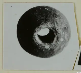 Disc-shaped piece of jewellery with a large central hole, from Lapithos, Vrysi tou Barba tombs