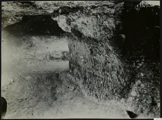 Tomb 315 at Lapithos, Vrysi tou Barba: tomb chamber with stones and a rounded object during excavation