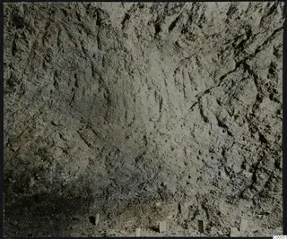 Tomb 302 at Lapithos, Vrysi tou Barba: close view of a tomb chamber surface marked by tool strokes during excavation