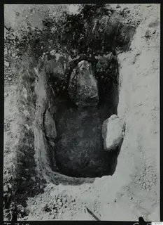 Tomb 319 at Lapithos, Vrysi tou Barba: tomb chamber during excavation, with two large stones inside.