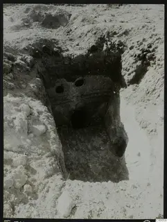 Tomb 311 at Lapithos, Vrysi tou Barba: excavated tomb chamber with two round openings in its wall face