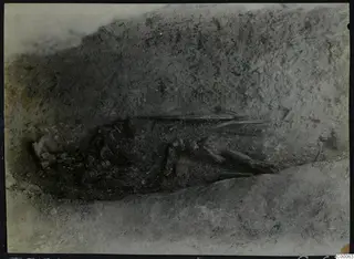 Tomb 313 B at Lapithos: skeleton and objects in the tomb chamber during excavation