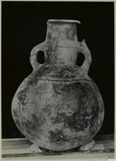 Pottery Red Polished III amphora with two loop handles and a wide round body, shown against a dark background.