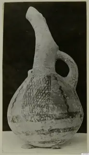Pottery White Painted I - II vessel: a jug with a tall spout-like neck, loop handle and dark painted bands and lattice pattern