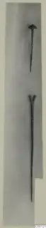 Two bronze tools from the Vrysi tou Barba tombs at Lapithos, one with a rounded head and one with a forked head