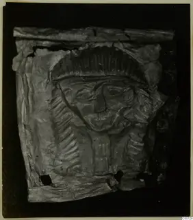 Embossed metal sheet with a face and ridged headdress, from Lapithos Kastros tombs