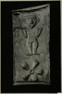 Rectangular metal plaque with a raised relief of a standing figure, from Lapithos Kastros tombs.