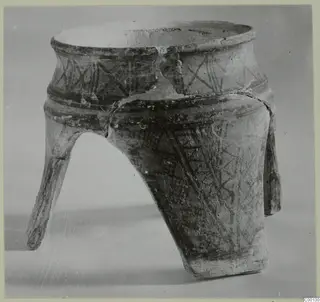 Tripod pottery vessel from Lapithos, White Painted I, with dark painted bands and three splayed legs