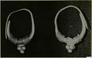 Two gold earrings with coiled wire on the lower part of the loop, from the Kastros tombs at Lapithos