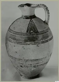Bichrome I pottery jug from Lapithos, with dark painted bands and a hatched triangle on the shoulder
