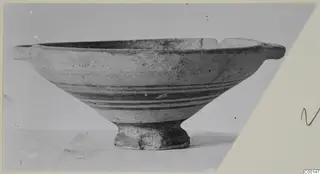 White Painted I bowl from the Kastros tombs at Lapithos, with two small horizontal handles and a ring foot