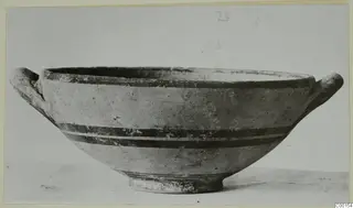 White Painted I bowl with two handles and dark painted bands, photographed on a card mount