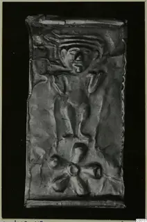 Embossed thin metal sheet with a human face and a figure, find from Lapithos
