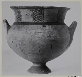 Pottery White Painted I bowl with cross-hatched bands on the neck, two small handles and a footed base.