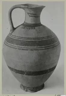 White Painted I jug from the Kastros tombs at Lapithos, with a loop handle and dark painted bands