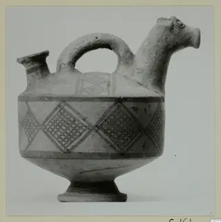 White Painted I jug, askos, from the Kastros tombs at Lapithos, with an animal-head spout and painted diamond lattice bands