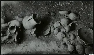 Tomb 403 at Lapithos: pottery vessels lying on the floor of the tomb chamber during excavation