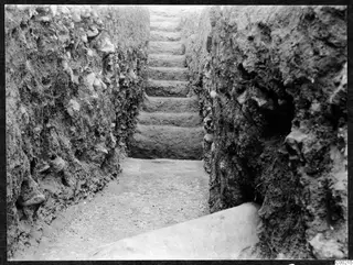 Stone steps rising between excavated earth faces in a trench at the theatre at Soli