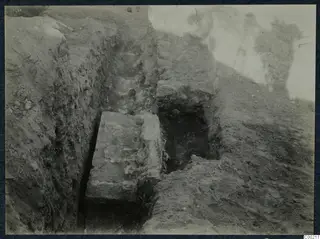 Excavation trench at the theatre at Soli, with a large stone block and rubble stonework.