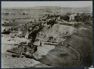 Excavation of the theatre at Soli, with workers clearing the orchestra seen from the west