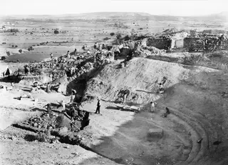 Excavation of the theatre at Soli, with workers on the orchestra seen from the west