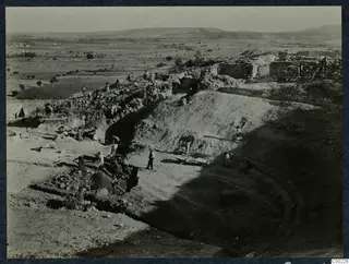 Excavation of the theatre at Soli, workers clearing the orchestra, seen from the west