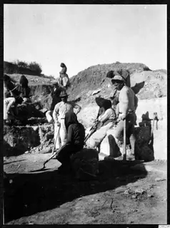 Workers with spades among excavated earth and cut stone at the theatre at Soli.