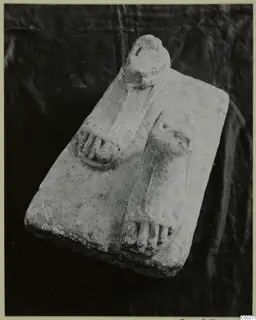 Limestone sculpture base with two carved feet from Vouni