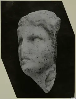 Marble head fragment from Soli, showing the brow, eye, nose and mouth of a face