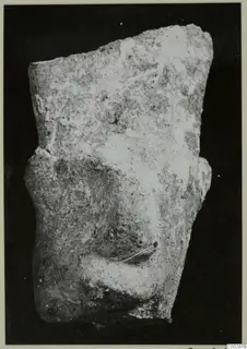 Fragment of a modelled terracotta figure showing a nose and lips, broken along the top and sides