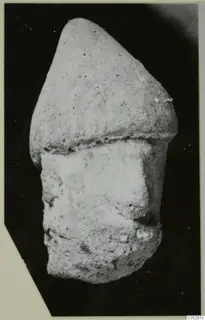 Terracotta head from Soli, with a domed upper part above a broken lower section