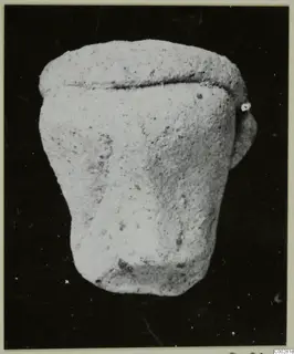 Terracotta Minor Plastic 3, a small pale squat object with a groove near the top and a short projection on one side