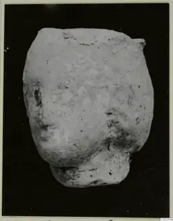 Terracotta fragment, Minor Plastic 2, from Soli, photographed against a dark background