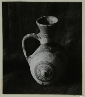 Pottery Bichrome II jug from Lapithos, with a loop handle and concentric circles painted on its body
