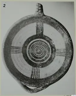Pottery White Painted I bowl from Lapithos: a flat round vessel with a short neck and painted spiral and band decoration