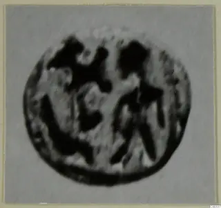 Round stone glyptic object from Lapithos Tomb 403, shown face-on and very blurred