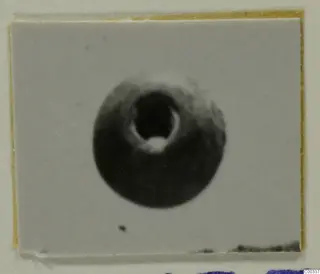 Small round stone object with a large central hole, from Lapithos Tomb 403