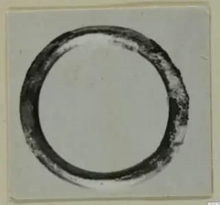 Gold ring from the Kastros tombs at Lapithos, shown close up on a pale background
