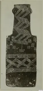 Plank-shaped idol from Lapithos, decorated with incised zigzag and banded patterns.