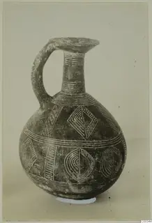Red Polished II jug from Lapithos with incised bands and lozenge motifs filled with light pigment