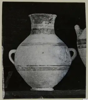 Two-handled jar with a tall flared neck and dark horizontal bands, from Tomb 403 at Lapithos