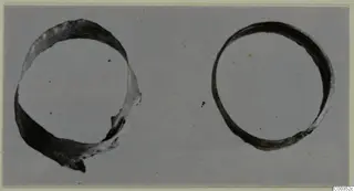 Two gold rings of band form, one broken, photographed on a grey background, from the Kastros tombs at Lapithos
