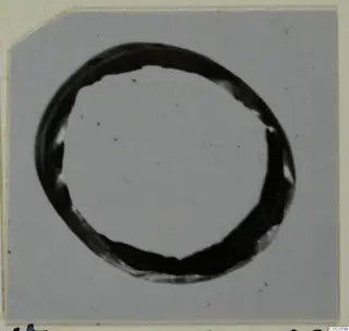 Gold ring, one of the find group of gold rings, pins and pendants, shown against a grey background