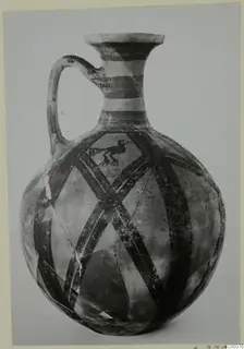 Bichrome wheel-made jug from Milia with banded neck, diagonal lattice pattern and a painted bird on the body