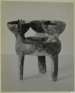 Tripod pottery vessel from Lapithos with three bowl-shaped mouths and incised chevron and hatched triangle decoration