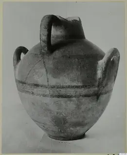 Painted pottery vessel with three handles and black bands, from the Kastros tombs at Lapithos